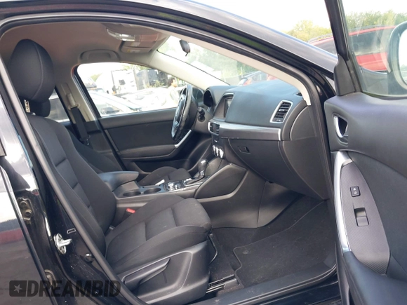 2016 Mazda CX-5 Touring with VIN JM3KE2CY5G0653108, listed as a IAAI auction lot 37717249 with 90,704 mi miles and . Bid and sale history available at DreamBid. Image 5.