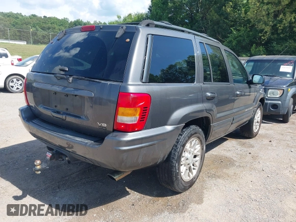 2002 Jeep Grand Cherokee Limited with VIN 1J4GW58J02C163931, listed as a IAAI auction lot 42632552 with 228,955 mi miles and . Bid and sale history available at DreamBid. Image 4.