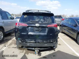 2018 Toyota RAV4 LE with VIN 2T3ZFREV9JW457062, listed as a IAAI auction lot 41696609 with 96,716 mi miles. Bid and sale history available at carsss.com. Image 16.