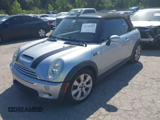 2006 MINI Convertible S with VIN WMWRH33596TK59633, listed as a IAAI auction lot 42242545 with 77,837 mi miles and . Bid and sale history available at DreamBid. Image 2.