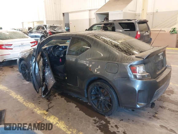 2014 Scion tC with VIN JTKJF5C77E3069906, listed as a IAAI auction lot 41243445 with 128,791 mi miles. Bid and sale history available at carsss.com. Image 3.