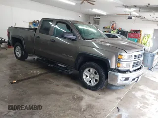 2014 Chevrolet Silverado 1500 LT with VIN 1GCVKREC5EZ147506, listed as a IAAI auction lot 41736960 with 112,399 mi miles and . Bid and sale history available at DreamBid. Image 1.