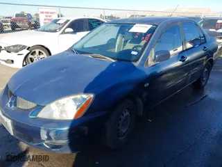 2005 Mitsubishi Lancer ES with VIN JA3AJ26E65U014838, listed as a IAAI auction lot 41310586 with 127,487 mi miles. Bid and sale history available at carsss.com. Image 17.