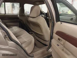 2004 Mercury Grand Marquis GS with VIN 2MEFM74W04X618043, listed as a IAAI auction lot 41985566 with 192,836 mi miles. Bid and sale history available at carsss.com. Image 8.