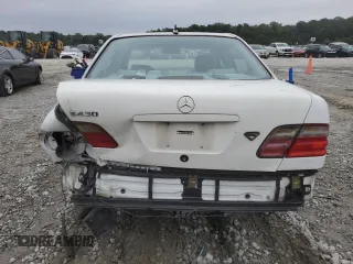 2000 Mercedes-Benz E-Class with VIN WDBJF70J1YB078418, listed as a Copart auction lot 71177244 with 189,838 mi miles and Salvage Title. Bid and sale history available at carsss.com. Image 6.