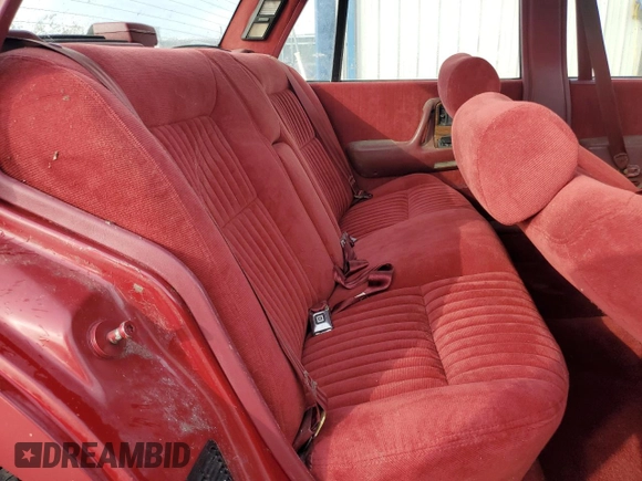 1990 Pontiac Bonneville z VIN 1G2HX54C7L1244134, wystawiony jako Copart lot #77859884 z przebiegiem 104 905 mil mil oraz Czysty tytuł • Clean title. Historia ofert i sprzedaży dostępna na DreamBid. Obrazek 10.