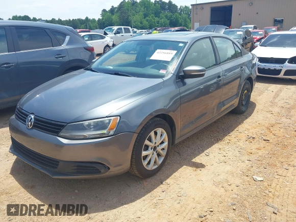 2011 Volkswagen Jetta SE with VIN 3VWDX7AJ4BM330203, listed as a IAAI auction lot 42256889 with 209,557 mi miles and . Bid and sale history available at DreamBid. Image 2.