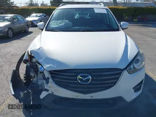 2016 Mazda CX-5 Sport with VIN JM3KE2BY9G0879654, listed as a IAAI auction lot 41819154 with 65,586 mi miles. Bid and sale history available at carsss.com. Image 12.
