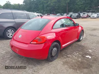 2012 Volkswagen Beetle 2.5L PZEV with VIN 3VWJP7AT2CM665045, listed as a IAAI auction lot 40222839 with 114,624 mi miles. Bid and sale history available at carsss.com. Image 4.