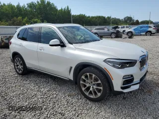 2019 BMW X5 xDrive40i with VIN 5UXCR6C5XKLK80703, listed as a Copart auction lot 63473495 with 57,260 mi miles and Salvage title. Bid and sale history available at DreamBid. Image 4.
