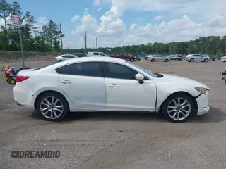 2014 Mazda 6 i Touring with VIN JM1GJ1V64E1142643, listed as a IAAI auction lot 42229322 with 215,095 mi miles and . Bid and sale history available at DreamBid. Image 13.
