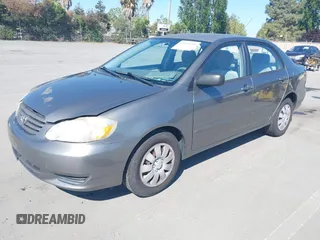 2004 Toyota Corolla CE with VIN 1NXBR32E64Z303089, listed as a IAAI auction lot 42147550 with 232,062 mi miles. Bid and sale history available at carsss.com. Image 2.