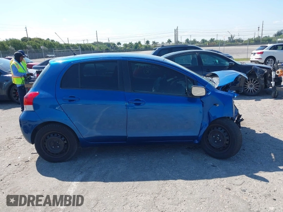 2009 Toyota Yaris with VIN JTDKT903X95257701, listed as a IAAI auction lot 41796420 with 86,953 mi miles. Bid and sale history available at carsss.com. Image 14.