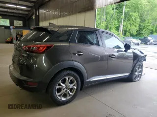 2016 Mazda CX-3 Grand Touring z VIN JM1DKBD77G0116689, wystawiony jako Copart lot #57729405 z przebiegiem 174 965 mil mil oraz Szkoda całkowita • Salvage title. Historia ofert i sprzedaży dostępna na DreamBid. Obrazek 3.