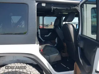 2014 Jeep Wrangler Unlimited Rubicon with VIN 1C4BJWFG1EL167423, listed as a IAAI auction lot 41861109 with 104,669 mi miles. Bid and sale history available at carsss.com. Image 8.