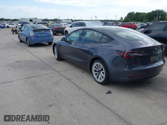 2021 Tesla Model 3 Long Range with VIN 5YJ3E1EB4MF855581, listed as a IAAI auction lot 41974515 with 71,561 mi miles. Bid and sale history available at carsss.com. Image 3.