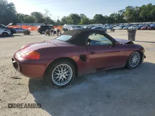 2000 Porsche Boxster z VIN WP0CA2983YU621350, wystawiony jako Copart lot #60596005 z przebiegiem 93 133 mil mil oraz Szkoda całkowita • Salvage title. Historia ofert i sprzedaży dostępna na DreamBid. Obrazek 3.