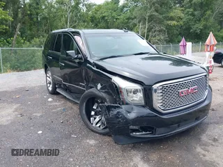 2016 GMC Yukon Denali with VIN 1GKS1CKJXGR254306, listed as a IAAI auction lot 39953539 with 164,149 mi miles. Bid and sale history available at carsss.com. Image 1.