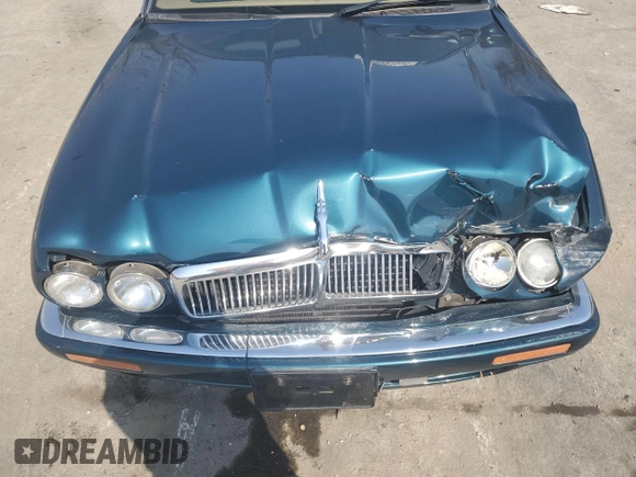 1996 Jaguar XJ z VIN SAJHX1746TC756451, wystawiony jako Copart lot #48991655 z przebiegiem 115 015 mil mil oraz Szkoda całkowita • Salvage title. Historia ofert i sprzedaży dostępna na DreamBid. Obrazek 12.