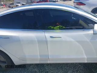 2018 Tesla Model 3 Long Range Battery with VIN 5YJ3E1EA7JF020173, listed as a IAAI auction lot 42046312 with 83,395 mi miles and . Bid and sale history available at DreamBid. Image 14.