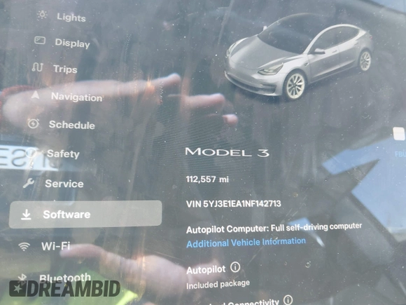 2022 Tesla Model 3 with VIN 5YJ3E1EA1NF142713, listed as a IAAI auction lot 42027630 with 112,557 mi miles. Bid and sale history available at carsss.com. Image 14.