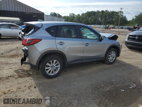 2015 Mazda CX-5 Touring with VIN JM3KE2CY7F0435914, listed as a Copart auction lot 61885704 with 0 mi miles and Salvage Title. Bid and sale history available at carsss.com. Image 3.