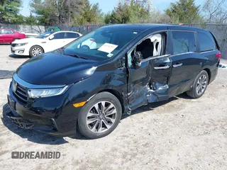 2022 Honda Odyssey EX-L with VIN 5FNRL6H72NB002554, listed as a IAAI auction lot 41932297 with 23,533 mi miles and . Bid and sale history available at DreamBid. Image 2.