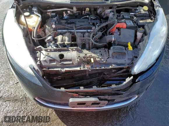 2012 Ford Fiesta SE z VIN 3FADP4EJ4CM183237, wystawiony jako Copart lot #48825605 z przebiegiem 92 798 mil mil oraz Szkoda całkowita • Salvage title. Historia ofert i sprzedaży dostępna na DreamBid. Obrazek 11.