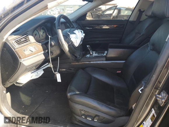 2011 BMW 7 Series 740i with VIN WBAKA4C57BC612487, listed as a Copart auction lot 82633554 with 0 mi miles and Salvage Title. Bid and sale history available at carsss.com. Image 7.