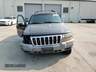 1999 Jeep Grand Cherokee Laredo with VIN 1J4G258S9XC731752, listed as a Copart auction lot 58601555 with 245,284 mi miles and Salvage title. Bid and sale history available at DreamBid. Image 13.