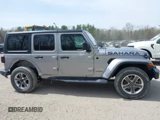 2018 Jeep Wrangler Unlimited Sahara with VIN 1C4HJXEG4JW141540, listed as a IAAI auction lot 42148402 with 43,909 mi miles and . Bid and sale history available at DreamBid. Image 13.