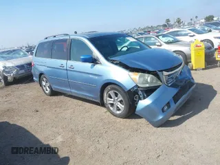 2010 Honda Odyssey Touring with VIN 5FNRL3H92AB056186, listed as a IAAI auction lot 41851386 with 199,109 mi miles. Bid and sale history available at carsss.com. Image 1.