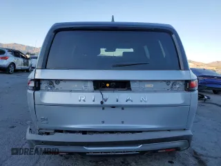 2025 Rivian R1S Adventure with VIN 7PDSGBBA0SN051096, listed as a Copart auction lot 87441054 with 30 mi miles and Salvage Title. Bid and sale history available at carsss.com. Image 6.