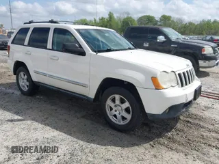 2010 Jeep Grand Cherokee Laredo with VIN 1J4PR4GK0AC151711, listed as a IAAI auction lot 41940295 with 185,684 mi miles. Bid and sale history available at carsss.com. Image 1.