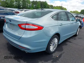 2014 Ford Fusion SE Hybrid with VIN 3FA6P0LU7ER154559, listed as a IAAI auction lot 42198548 with 244,630 mi miles. Bid and sale history available at carsss.com. Image 4.