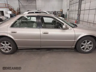 2004 Cadillac Seville Luxury SLS with VIN 1G6KS54Y74U163861, listed as a IAAI auction lot 41881291 with 215,518 mi miles. Bid and sale history available at carsss.com. Image 14.
