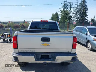 2014 Chevrolet Silverado 1500 LT with VIN 3GCUKREH0EG399090, listed as a IAAI auction lot 42142324 with 104,226 mi miles and . Bid and sale history available at DreamBid. Image 16.