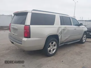 2015 Chevrolet Suburban LT with VIN 1GNSCJKC4FR744208, listed as a IAAI auction lot 41612915 with 87,445 mi miles and . Bid and sale history available at DreamBid. Image 4.