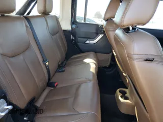 2014 Jeep Wrangler Unlimited Rubicon X with VIN 1C4HJWFG8EL119654, listed as a Copart auction lot 46699055 with 148,412 mi miles and Salvage title. Bid and sale history available at DreamBid. Image 11.