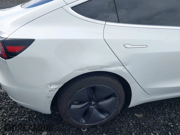 2018 Tesla Model 3 Long Range Battery with VIN 5YJ3E1EA3JF013253, listed as a IAAI auction lot 41752102 with 84,459 mi miles. Bid and sale history available at carsss.com. Image 20.