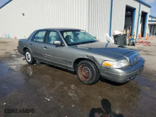 2000 Ford Crown Victoria with VIN 2FAFP73W0YX173874, listed as a Copart auction lot 82113564 with 108,425 mi miles and Salvage Title. Bid and sale history available at carsss.com. Image 4.