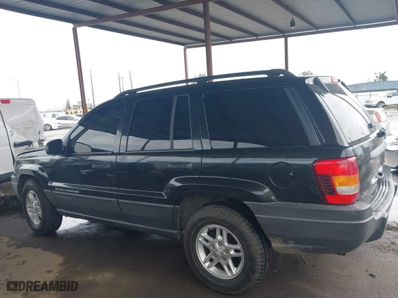 2004 Jeep Grand Cherokee Laredo with VIN 1J4GX48N94C435700, listed as a IAAI auction lot 41809624 with 147,413 mi miles. Bid and sale history available at carsss.com. Image 14.