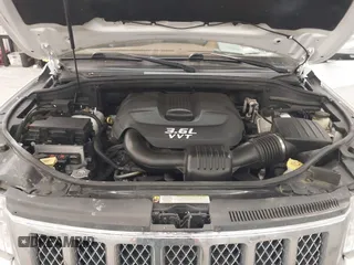 2013 Jeep Grand Cherokee Overland with VIN 1C4RJFCG7DC581808, listed as a IAAI auction lot 41242922 with 187,442 mi miles. Bid and sale history available at carsss.com. Image 10.