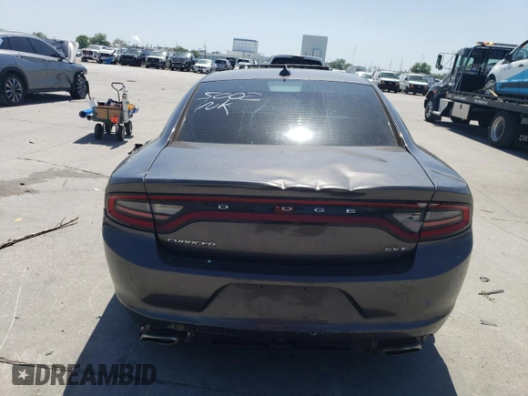 2015 Dodge Charger SXT z VIN 2C3CDXHG7FH765002, wystawiony jako Copart lot #52357755 z przebiegiem 132 453 mil mil oraz Szkoda całkowita • Salvage title. Historia ofert i sprzedaży dostępna na DreamBid. Obrazek 6.