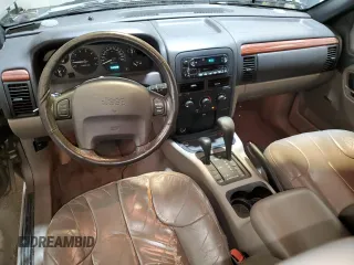 1999 Jeep Grand Cherokee Laredo with VIN 1J4GW58N0XC686845, listed as a Copart auction lot 48877805 with 155,908 mi miles and Clean title. Bid and sale history available at DreamBid. Image 8.