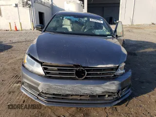 2016 Volkswagen Jetta Sport z VIN 3VWD17AJ3GM242719, wystawiony jako Copart lot #62234275 z przebiegiem 73 394 mil mil oraz Szkoda całkowita • Salvage title. Historia ofert i sprzedaży dostępna na DreamBid. Obrazek 5.