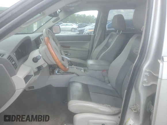 2007 Jeep Grand Cherokee Overland with VIN 1J8HR68227C579883, listed as a Copart auction lot 65282225 with 224,059 mi miles and Clean title. Bid and sale history available at DreamBid. Image 7.
