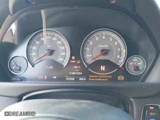 2015 BMW M4 with VIN WBS3R9C57FK334921, listed as a IAAI auction lot 41869773 with 107,058 mi miles. Bid and sale history available at carsss.com. Image 7.