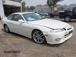 1998 Lexus SC 300 z VIN JT8CD32Z6W1003386, wystawiony jako IAAI lot #42169196 z przebiegiem 290 205 mil mil oraz . Historia ofert i sprzedaży dostępna na DreamBid. Obrazek 1.