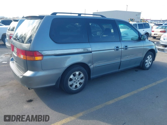 2002 Honda Odyssey EX z VIN 5FNRL186X2B014652, wystawiony jako IAAI lot #41950225 z przebiegiem 286 959 mil mil oraz . Historia ofert i sprzedaży dostępna na DreamBid. Obrazek 4.